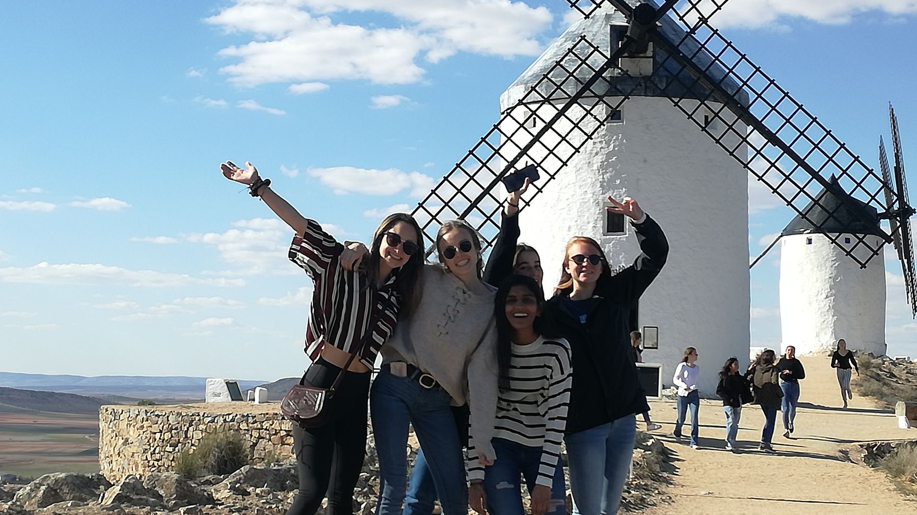 Students on an exchange trip at the windmills of La Mancha